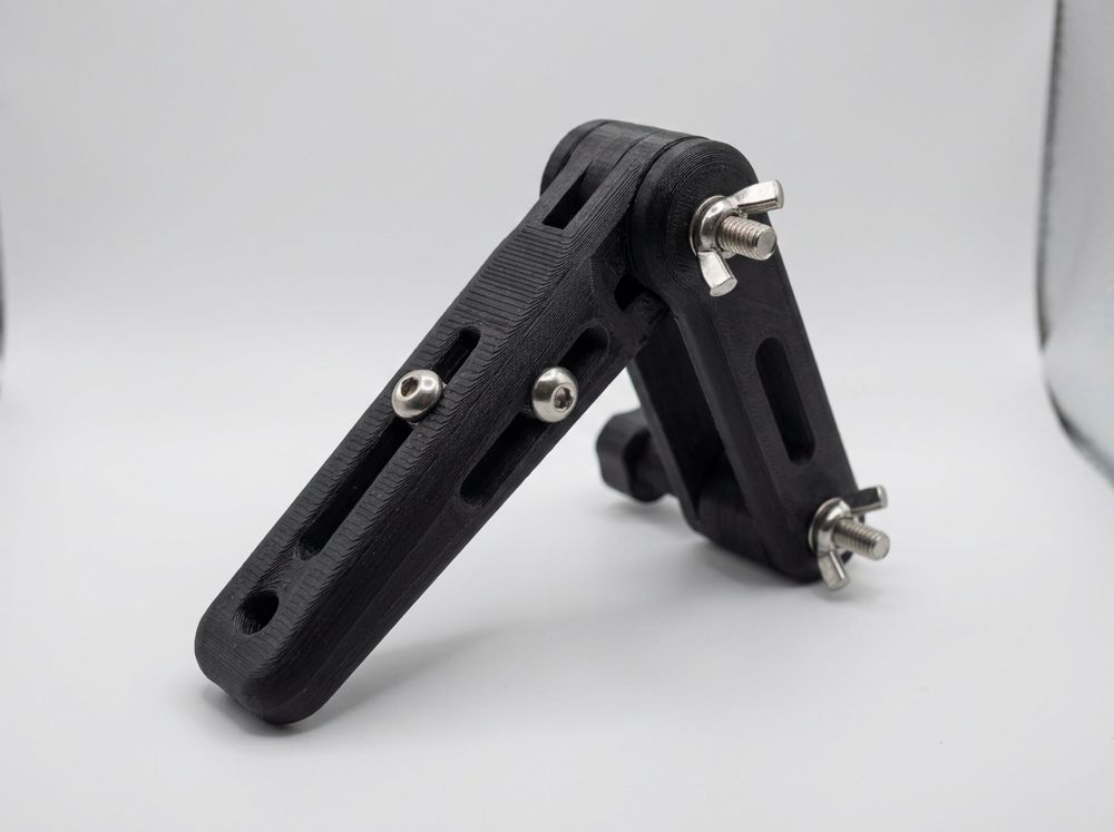 Concept render of an adjustable black bracket with slots, wing nuts and stainless screws